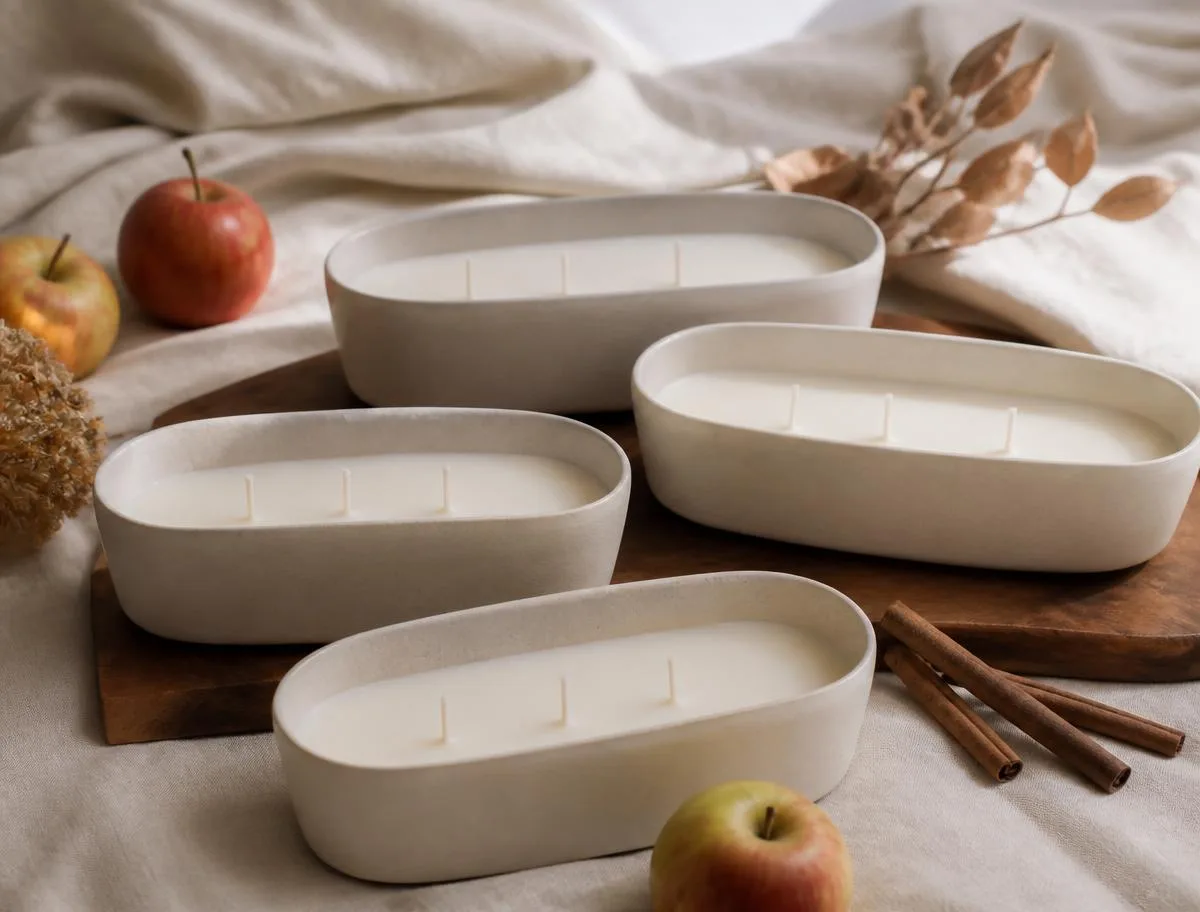 Ceramic candle vessels with cinnamon and cream linen